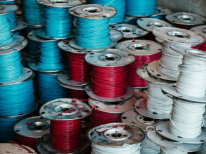 Spools of red, white, and blue wire